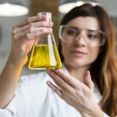 defocused-female-scientist-holding-test-tube